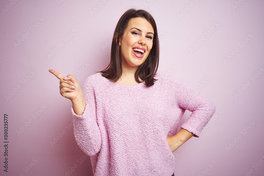 Sticker young beautiful brunette woman wearing a sweater over pink isolated background with a big smile on f