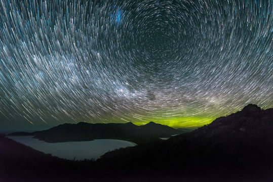 Aurora Australis and star trails over Wineglass Bay, Tasmania