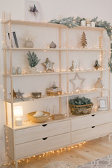 Fototapeta na wymiar new year's interior. shelves with Christmas decor and decorations