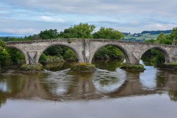 Fototapeta na wymiar Arched stone bridge in the Highlands, Scotland