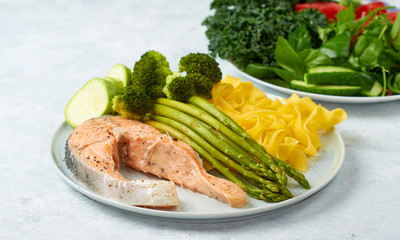 Healthy food, steamed salmon, with steamed vegetables. Eggplant, broccoli, asparagus.