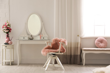Stylish room interior with white dressing table