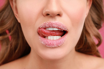 Beautiful young woman with sugar lips, closeup