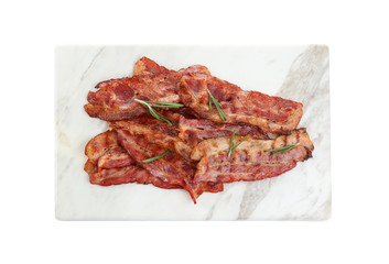 Slices of tasty fried bacon on white background, top view