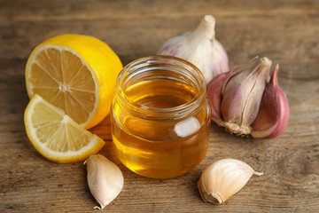 Composition with cold remedies on wooden table. Sore throat treatment