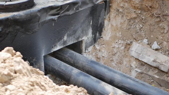 reconstruction of city utility sewage system, replacing old steel pipes with pvc tubes. 4k UHD video concept