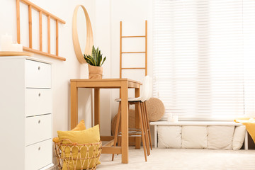Stylish room interior with wooden table and bar stools