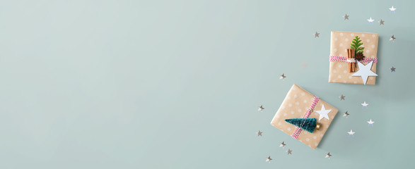 Handmade Christmas gift boxes with ornaments - flat lay