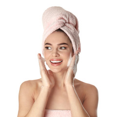 Young woman washing face with soap on white background