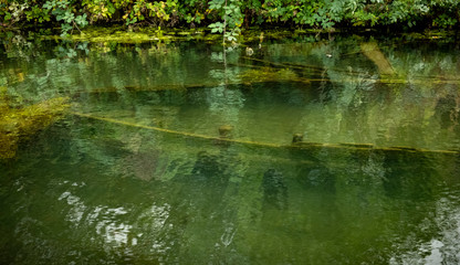 Sunk narrow boats in a canal at Black Country Museum Stafford England UK
