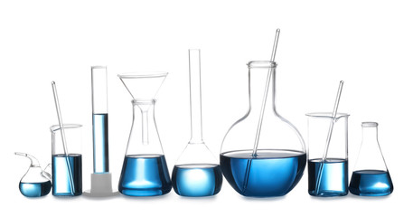 Set of laboratory glassware with blue liquid isolated on white