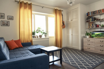 Clean family room with blue couch
