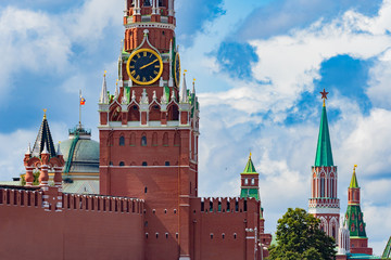 Fototapeta premium Moscow. Russia. Kremlin. Spasskaya Tower. Kremlin towers. Chimes of the Spassky tower. Time in Moscow. Excursions on the Red Square. Sights of Moscow. Cities of Russia. Skyline of the capital.