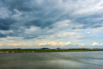 In summer, beautiful coastline and island scenery in cloudy background.