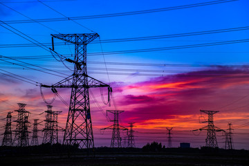 Fototapeta premium Contour of Transmission Tower at Sunset