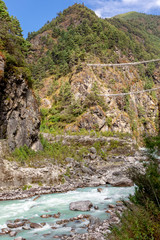 Suspention bridge on the Everest Base Camp Trek, Himalaya mountains, Sagarmatha National Park, Nepal.