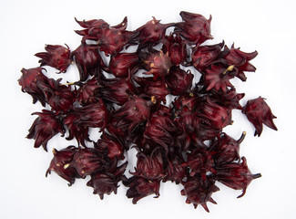 Obraz premium Roselle fruit on white background, Rosella, Jamaican sorel, Roselle, Rozelle, Sorrel, Red sorrel, Kharkade, Karkade, Vinuela, Cabitutu