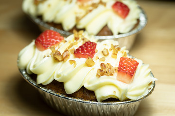Carrot cake decorated with strawberries and butter peas