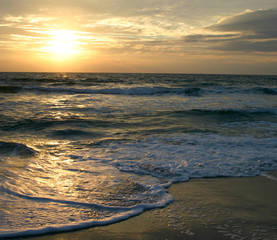 Dark, Restless Tide at Sunset