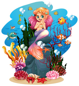Mermaid and fish underwater