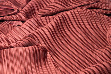 Pleat Fabric in long line drape with shadow, pleated style of textile pattern in red burgundy color...