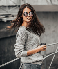 Beautiful girl posing in the street. Urban style. Street fashion.