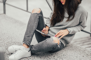 Beautiful girl posing in the street. Urban style. Street fashion.