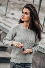 Beautiful girl posing in the street. Urban style. Street fashion.