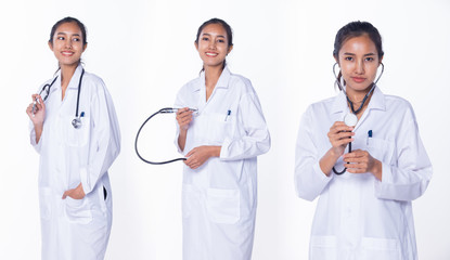 Fototapeta premium Professional Asian Beautiful Doctor Nurse woman in labcoat uniform wtih stethoscope on neck and check tablet smiles in Medical hospital, studio white background, collage group pack rear back side view