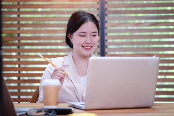 Concept business woman startup and people happy businesswoman or creative female office worker with computers writing to notebook