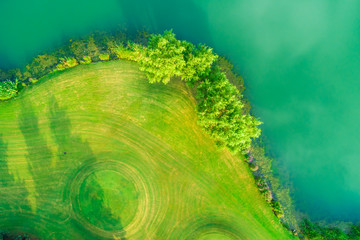 Aerial view of golf course and water