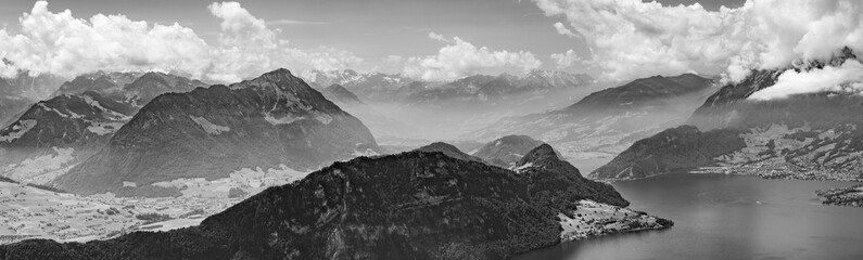Fototapeta na wymiar Switzerland, black and white panoramic view on green Alps and lake Lucerne