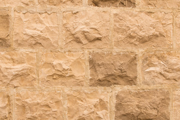 Background texture of the old fortress stone wall. Conceptual background for designers. Selective focus.