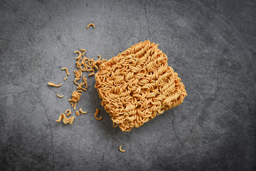 Top view of instant noodles on the dark background / Noodle thai junk food or fast food diet unhealthy eating