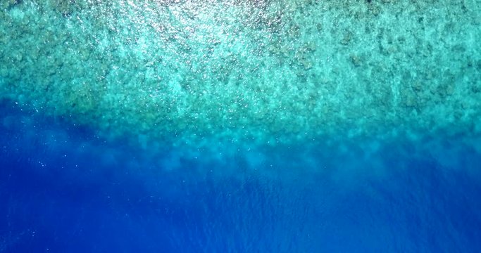Wonderful gradient colors from sea bottom near tropical island in Haiti, full of new corals and pebble