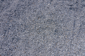 Top view of blue construction gravel texture background. Small granite stone full frame background.