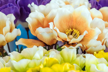 Close up to beautiful decoration artificial flower or faked flowers for sale at local market. Selective focus