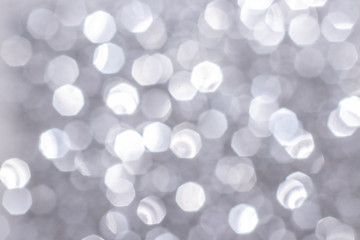 Silver glitter festive background with bokeh lights. Celebration concept for Holidays and anniversary.