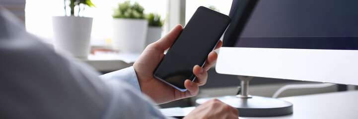 Businessman hipster holds telephone background of