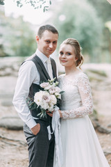 Beautiful couple at sunset in the Park. Wedding ceremony with arch in the forest.