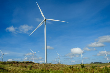 Fototapeta premium Wind turbines generating electricity with blue sky background,from wind power for environmental