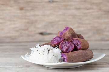 Steamed purple sweet potato in white plate