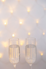New Year's glasses with champagne on a beautiful background. New Year 2020.