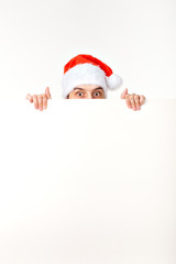 Santa man in christmas red hat for new year holiday with white paper sheet isolated on white background, copy space