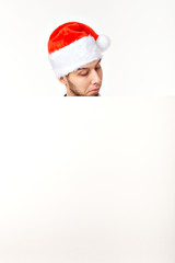 Santa man in christmas red hat for new year holiday with white paper sheet isolated on white background, copy space