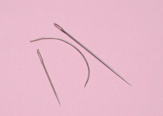 needle and thread on white background