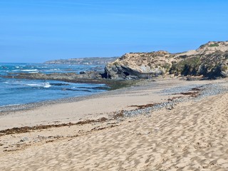 Oceanside with dunes in Vila Nova de Milfontes in Portugal at river Mira