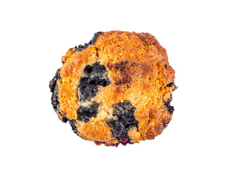 Homemade vegan blueberry muffin isolated. Top view or flat lay. Vegetarian egg-free muffin with blue berries isolated on whte with clipping path.