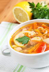 Fish soup with salmon close-up