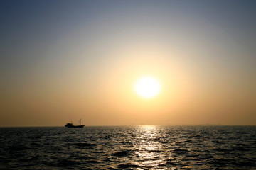 The fishing boats docked at the sea